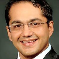 Dr. Ajit Auluck — Clinic Director & Manager